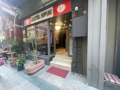 an entrance to a building with potted plants outside at Ufuk Hotel in Istanbul