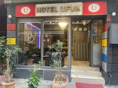 a store front of a hotel unit with plants in front at Ufuk Hotel in Istanbul