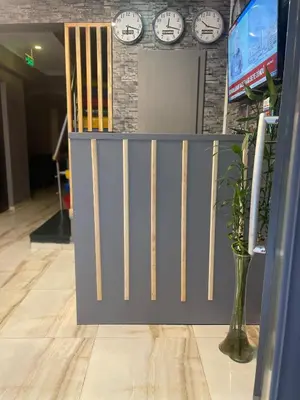a gate in a room with clocks on a wall at Ufuk Hotel in Istanbul