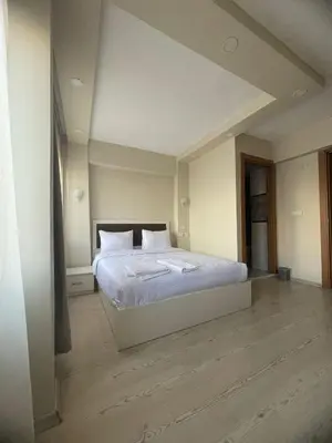 a bedroom with a white bed in a room at Ufuk Hotel in Istanbul