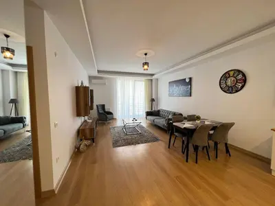 a living room with a table and a couch at Cozy Home 1 Room 1 Living Room Apartment in Esenyurt