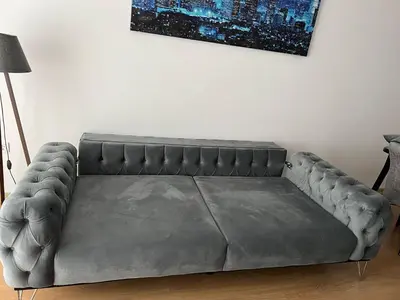 a leather couch in a room with a wall at Cozy Home 1 Room 1 Living Room Apartment in Esenyurt