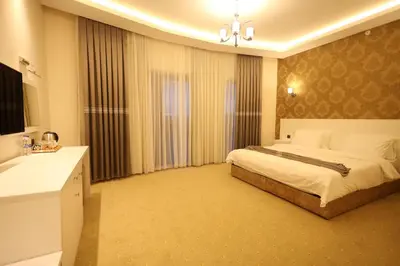 a bedroom with a bed and a sink in a room at Green Roof Boutique Hotel & SPA Istanbul Airport in Terkos