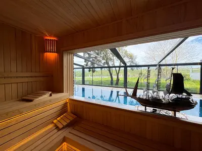 a sauna with a window with a boat in it at Green Roof Boutique Hotel & SPA Istanbul Airport in Terkos