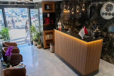 a bar in a store with chairs and a window at Avcı Palace Hotel in Istanbul