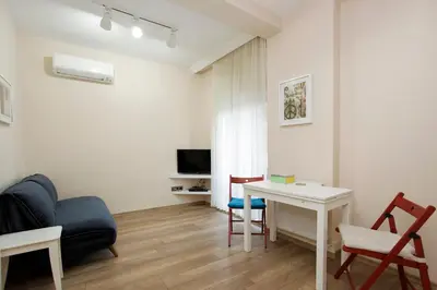 a living room with a couch and a table at Stay Juno in Istanbul