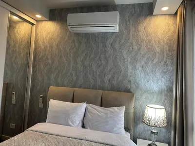 a bedroom with a bed with a air conditioner at 4+1 daire in Istanbul