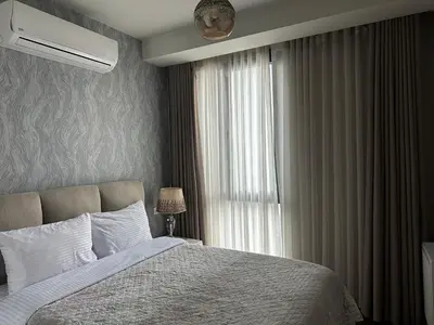 a bedroom with a bed and a window at 4+1 daire in Istanbul