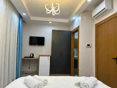 a bedroom with a bed with two towels at Koçyiğit Suite & Hotel in Istanbul