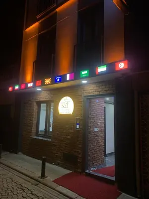 a building with a neon sign on the side of it at Koçyiğit Suite & Hotel in Istanbul