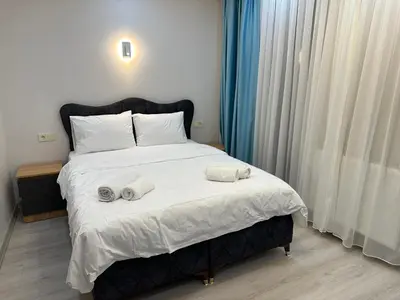 a bedroom with a bed with two towels on it at Koçyiğit Suite & Hotel in Istanbul