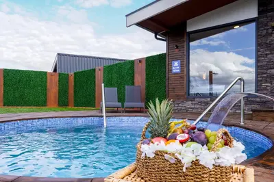 a basket of fruit sitting next to a swimming pool at Lake Look Sapanca in Sapanca