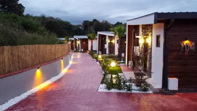 a brick walkway next to a house at night at Lake Look Sapanca in Sapanca