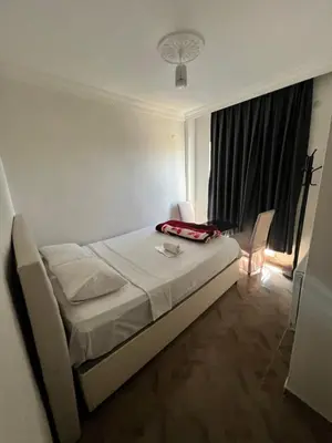 a hotel room with a bed and a window at Airport Confort Guest House in Arnavutköy