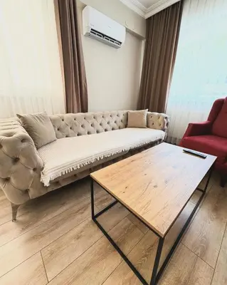 a living room with a couch and a coffee table at The rooms hotel in Kumbağ
