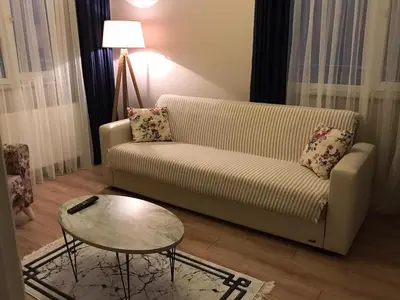 a living room with a couch and a table at The rooms hotel in Kumbağ