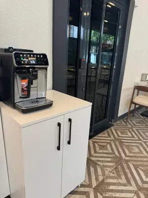 a coffee maker on top of a white cabinet at The rooms hotel in Kumbağ