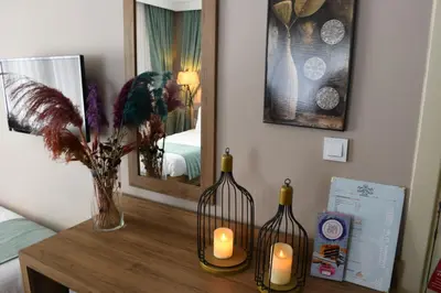a room with two wine bottles and candles on a table at Cibali Hotel Istanbul in Istanbul