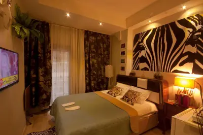 a bedroom with a bed with a zebra painting on the wall at Balance Hotel Taksim in Istanbul