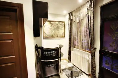 a hallway with a chair and a window at Balance Hotel Taksim in Istanbul