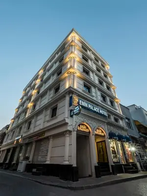 a large white building on the corner of a street at Emin Palace in Istanbul