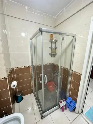 a bathroom with a shower with a toilet in it at Taksim Cihangir'de 2+1 daire in Istanbul