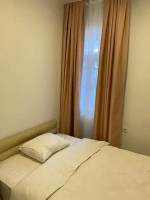 a bed with a pillow in front of a window at YENİKAPI hotel in Istanbul