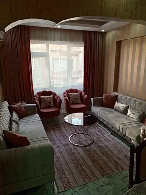 a living room with couches and a table at beyzade apart hotel in Istanbul