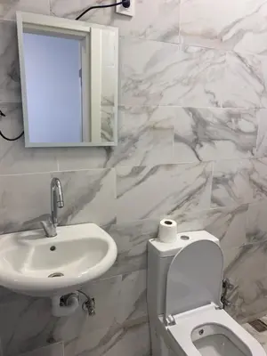 a bathroom with a sink and a toilet and a mirror at yenikapı HOTEL in Istanbul