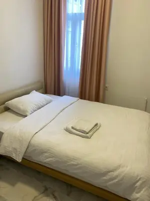 a bed with two towels on top of it at hotel yenikapı in Istanbul