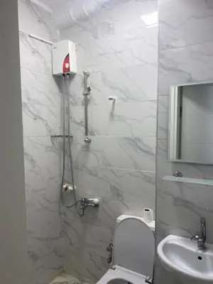 a bathroom with a shower and a toilet and a sink at hotel yenikapı in Istanbul