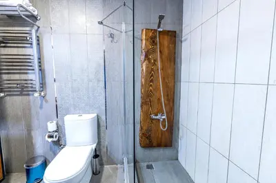a bathroom with a shower with a toilet and a glass door at Karakoy Aparts Hotel - Special Category in Istanbul
