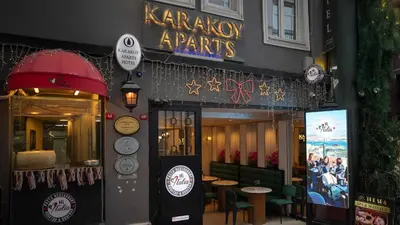 a karalystagents restaurant with tables and chairs in front of it at Karakoy Aparts Hotel - Special Category in Istanbul