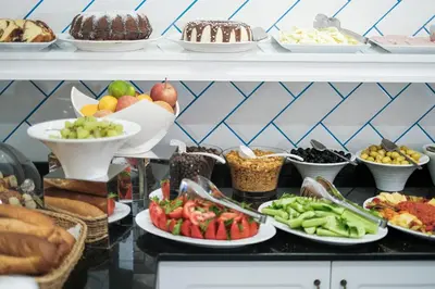a buffet with many plates of food on a shelf at Istanbul Old City Sultanahmed Miran Hotel in Istanbul