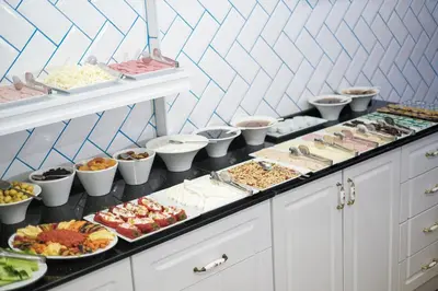 a buffet line with many different types of food at Istanbul Old City Sultanahmed Miran Hotel in Istanbul