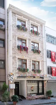 a brick building with flower boxes on it at Istanbul Old City Sultanahmed Miran Hotel in Istanbul