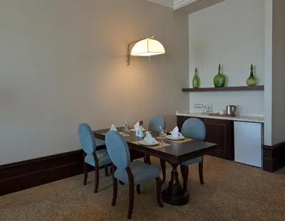 a dining room with a table and blue chairs at Vialand Palace Hotel in Istanbul