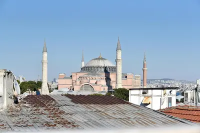a mosque with two minarets on top of roofs at Sunlife Oldcity in Istanbul