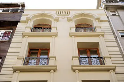 a tall white building with windows and balconies at Sunlife Oldcity in Istanbul