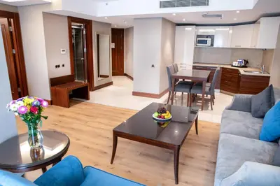 a living room with a couch and a table at Grand Aras Hotel & Suites in Istanbul