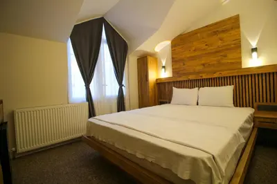a bedroom with a large bed and a window at Kaya Hotel SAW in Istanbul