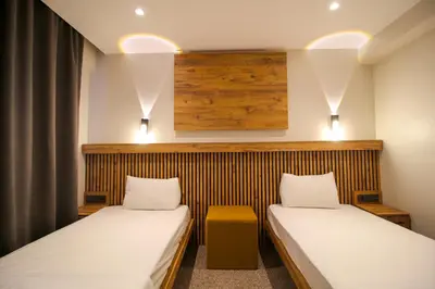 two beds in a small room with at Kaya Hotel SAW in Istanbul