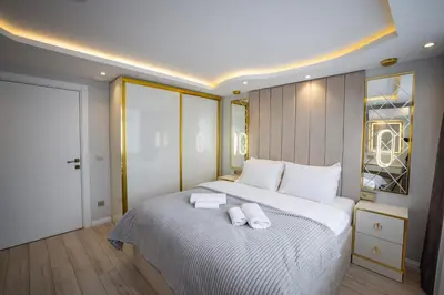 a bedroom with a large bed with two towels on it at ISTANBUL SUITE in Istanbul