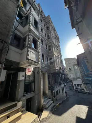 a building with a sign on the side of it at happy apart hotel istanbul in Istanbul