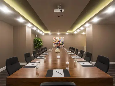 a conference room with a long table and chairs at Bilek Hotel Kavacık in Istanbul