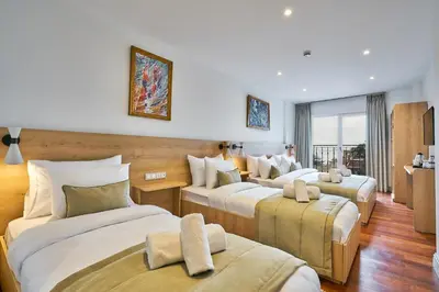 a hotel room with four beds in a room at Joyway Hotels Istanbul Sultanahmet in Istanbul