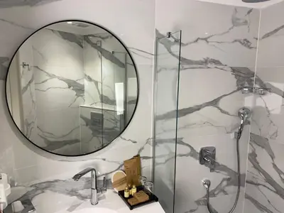 a bathroom with a mirror and a sink at Joyway Hotels Istanbul Sultanahmet in Istanbul