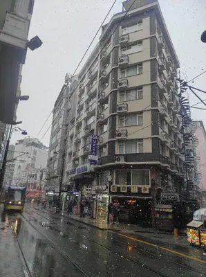 a building on a city street in the rain at Mara Oldcity Hotel in Istanbul