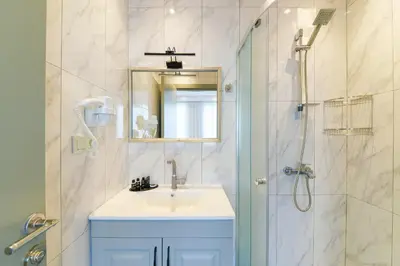 a bathroom with a sink and a shower at Rise Inn in Istanbul