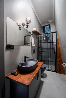 a bathroom with a sink on a wooden counter at Vital Home Sapanca Isıtmalı Havuzlu Villa&Bungalov in Sapanca
